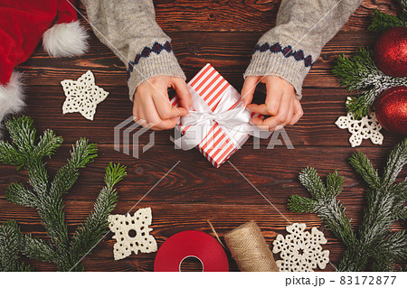 Christmas time. Process of packing gifts for holidays 83172877