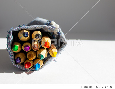 Bunch of pencils stylized tree branch. isolated on the white background in warm sunlight. 83173710