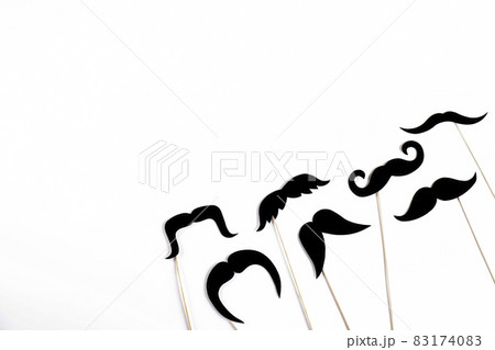 Paper party attributes in form of mustache on wooden stick. Carnival accessory concept. 83174083