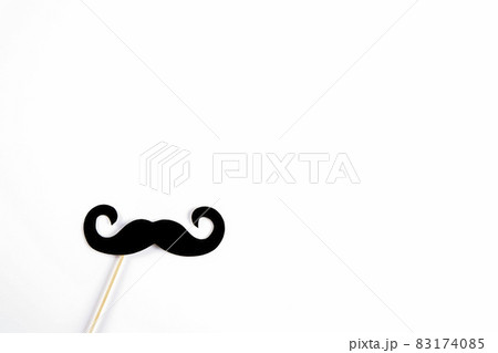 Paper party attributes in form of mustache on wooden stick. Carnival accessory concept. 83174085