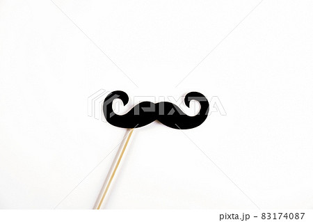 Paper party attributes in form of mustache on wooden stick. Carnival accessory concept. 83174087