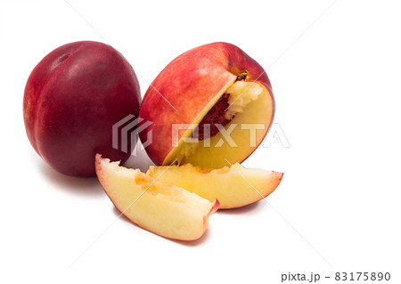 Ripe red nectarine and slices isolated on a white background 83175890