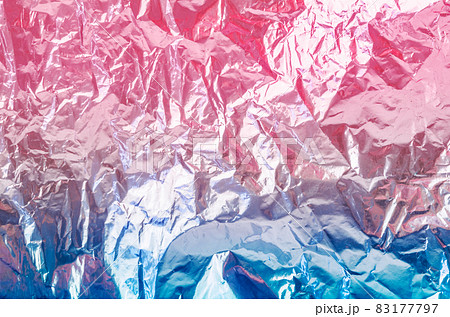 Colourful foil background with shiny crumpled surface. Colourful foil background with shiny crumpled surface. 83177797