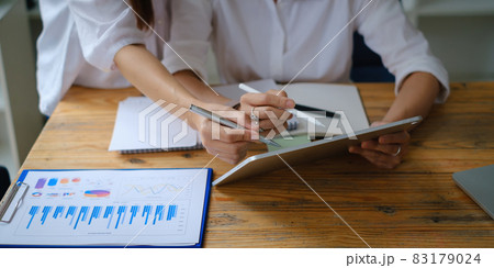 Business team working together and training to analyze technical price graph and indicator. Chart and stock trading computer screen. Business team working together and training to analyze technical price graph and indicator. Chart and stock trading computer screen. 83179024