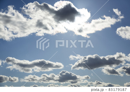 Heavenly clouds, blue sky with clouds background. Sky with clouds weather nature cloud blue. Sun behind clouds. Inspirational concept. Heavenly clouds, blue sky with clouds background. Sky with clouds weather nature cloud blue. Sun behind clouds. Inspirational concept. 83179187