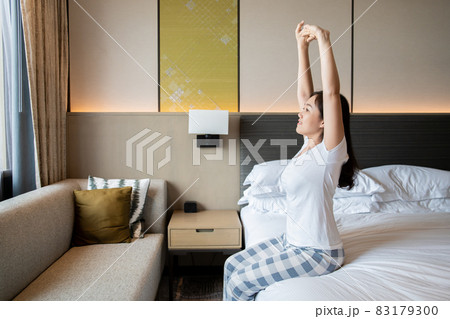 Woman just wake up from the bed. 83179300