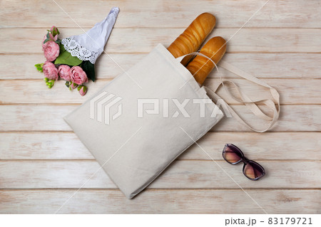 Tote bag mockup with pink flowers and french baguette 83179721