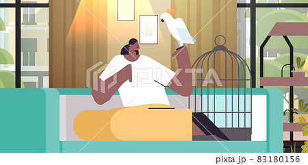 african american woman with parrot girl taking care of pet animal bird living room interior african american woman with parrot girl taking care of pet animal bird living room interior 83180156