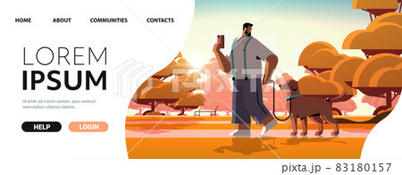 young man walking with dog in urban park male owner and cute domestic animal friendship with pet concept young man walking with dog in urban park male owner and cute domestic animal friendship with pet concept 83180157