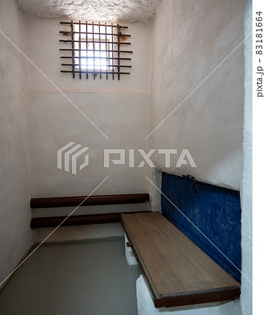Empty loner prison cell with bars on the window Empty loner prison cell with bars on the window 83181664
