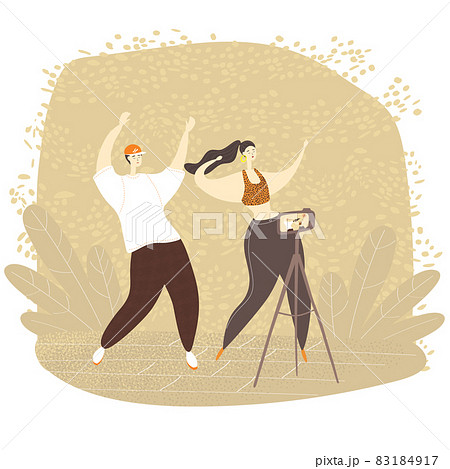 Video bloggers, male and female are dancing on camera. Young people live streaming with smart phone. Dance challenge Video bloggers, male and female are dancing on camera. Young people live streaming with smart phone. Dance challenge 83184917