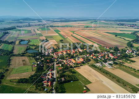 Small village near wind turbine generator, aerial view Small village near wind turbine generator, aerial view 83185670