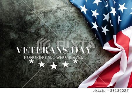 Veterans day. Honoring all who served. American flag on cement background Veterans day. Honoring all who served. American flag on cement background 83186027
