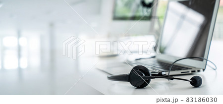 Headset and customer support equipment at call center ready for actively service Headset and customer support equipment at call center ready for actively service 83186030