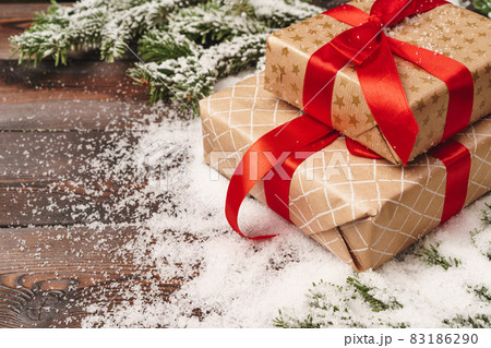 Wrapped gift for winter holidays background with copy space 83186290