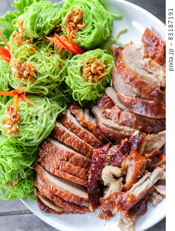 Roasted duck with green noodles. Roasted duck with green noodles. 83187191