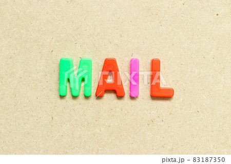 Color alphabet letter with word mail on wood background Color alphabet letter with word mail on wood background 83187350