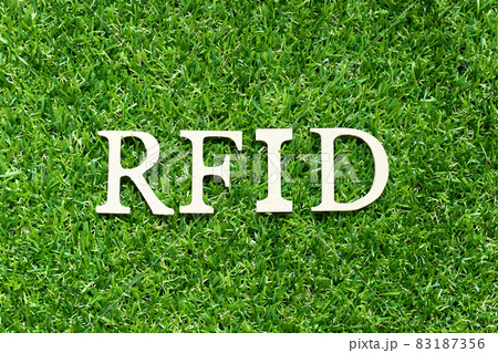 Alphabet letter in word RFID (Abbreviation of Radio-frequency identification) on green grass background Alphabet letter in word RFID (Abbreviation of Radio-frequency identification) on green grass background 83187356