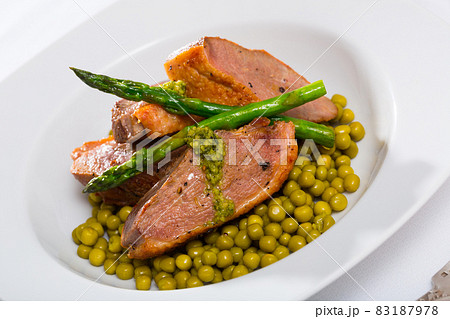 Grilled duck breast with vegetables 83187978