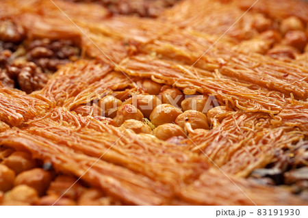 Close up of Turkish Baklava dessert with honey and nuts Close up of Turkish Baklava dessert with honey and nuts 83191930