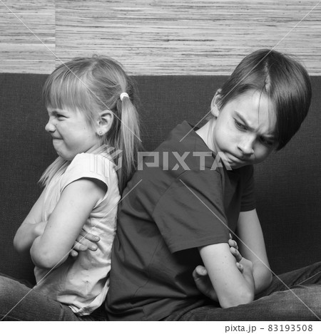 Siblings back to back arguing 83193508