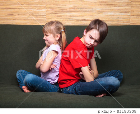 Siblings back to back arguing 83193509
