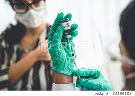 Young woman visits skillful doctor at hospital for vaccination 83194108