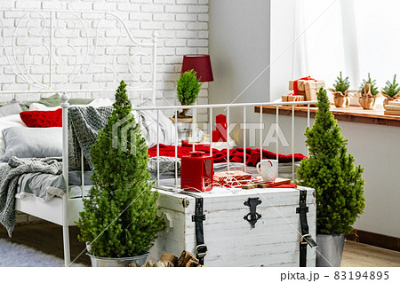 Modern light bedroom interior decorated for Christmas Modern light bedroom interior decorated for Christmas 83194895