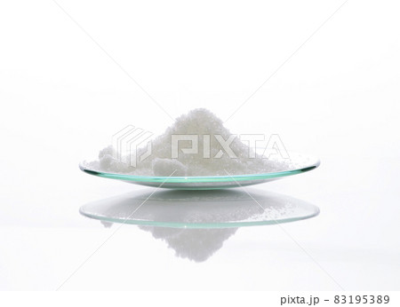 Close up chemical ingredient on white laboratory table. Di-Ammonium Prosphate in Chemical Watch Glass. Side View 83195389