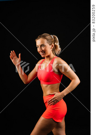 Attractive blonde caucasian smiling woman isolated on white, blue. Studio shot looking at camera 83200259