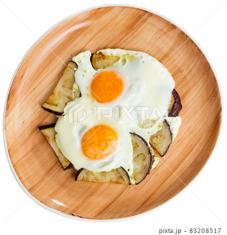 Delicious breakfast - scrambled eggs with fried eggplant closeup 83208517