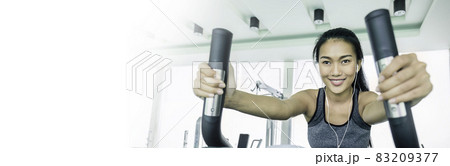 Portrait of beautiful smile healthy asian tan woman running on treadmill. People beauty perfect body slim, young asian fitness girl at gym sport club. Freedom happy relax lifestyle healthcare banner 83209377