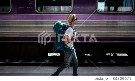 Traveler waits train at train station 83209675