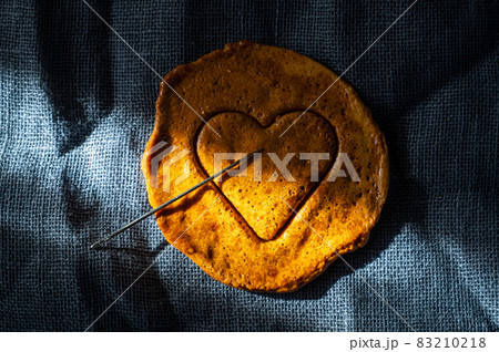 Brown sugar caramel candy cookies with a metal needle Brown sugar caramel candy cookies with a metal needle 83210218