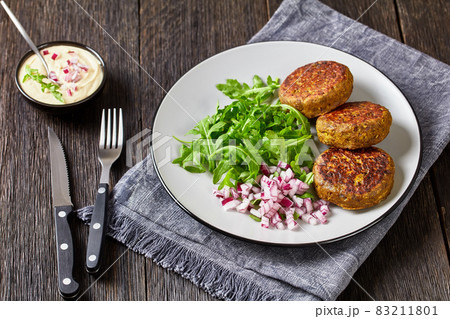 vegan lentil patties with rocket onion salad vegan lentil patties with rocket onion salad 83211801