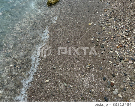 Wet colourful pebbles on the beach Wet colourful pebbles on the beach 83212484