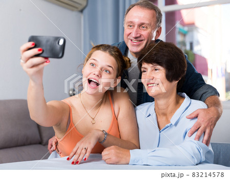 Happy family is taking selfie on the phone 83214578