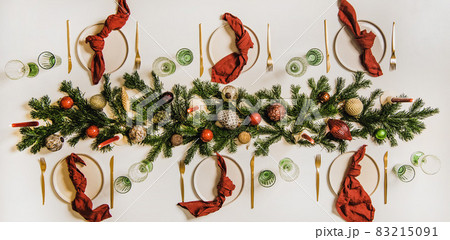 Flat-lay of festive Christmas table setting with Flat-lay of festive Christmas table setting with 83215091