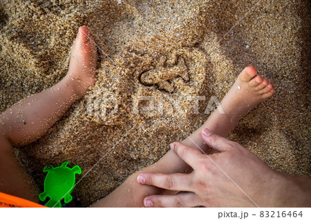 concept of opening flights between countries, end quarantine of the pandemic world planet. vacation abroad. trace from the sandbox mold in the form of an airplane on the sand of a beach next to concept of opening flights between countries, end quarantine of the pandemic world planet. vacation abroad. trace from the sandbox mold in the form of an airplane on the sand of a beach next to 83216464