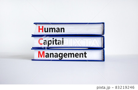 HCM, Human capital management symbol. Concept words HCM, Human capital management on books on a beautiful white background. Business, HCM, Human capital management concept. Copy space. 83219246