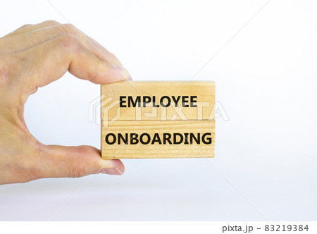 Employee onboarding success symbol. Wooden blocks with words 'Employee onboarding' on beautiful white background. Businessman hand. Business and employee onboarding success concept. Copy space. 83219384