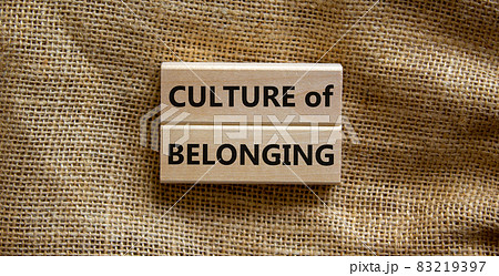 Culture of belonging symbol. Wooden blocks with words 'culture of belonging' on beautiful canvas background. Business, culture of belonging concept. Copy space. 83219397
