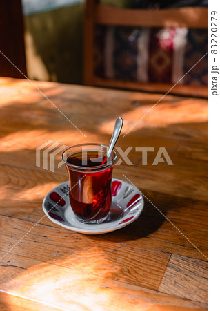 Cup of turkish tea on a wooden table in a cafe Cup of turkish tea on a wooden table in a cafe 83220279