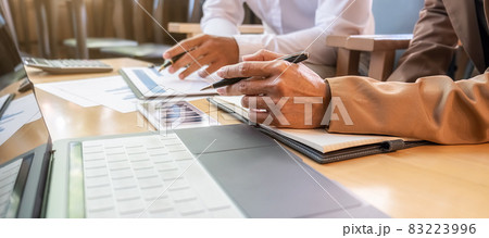 Business team brainstorming and discussing with financial data and report graph. Teamwork meeting working concept. Business team brainstorming and discussing with financial data and report graph. Teamwork meeting working concept. 83223996