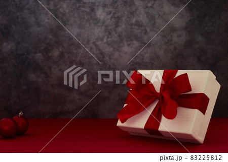 Composition with Christmas decorations on red background 83225812