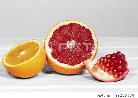 Fruits rich in Vitamin C such as pomergranate, grapefruit, orange. Trendy Food Composition 83225974
