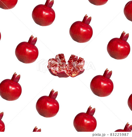 Pattern of a ripe red pomegranate on light pink background, Creative Food Concept, Flatlay 83225987