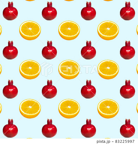 Pattern of a ripe red pomegranate on light blue background, Creative Food Concept, Flatlay 83225997