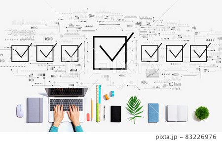 Checklist concept with person using a laptop Checklist concept with person using a laptop 83226976