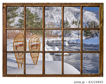 classic wooden snowshoes in mountains 83228895